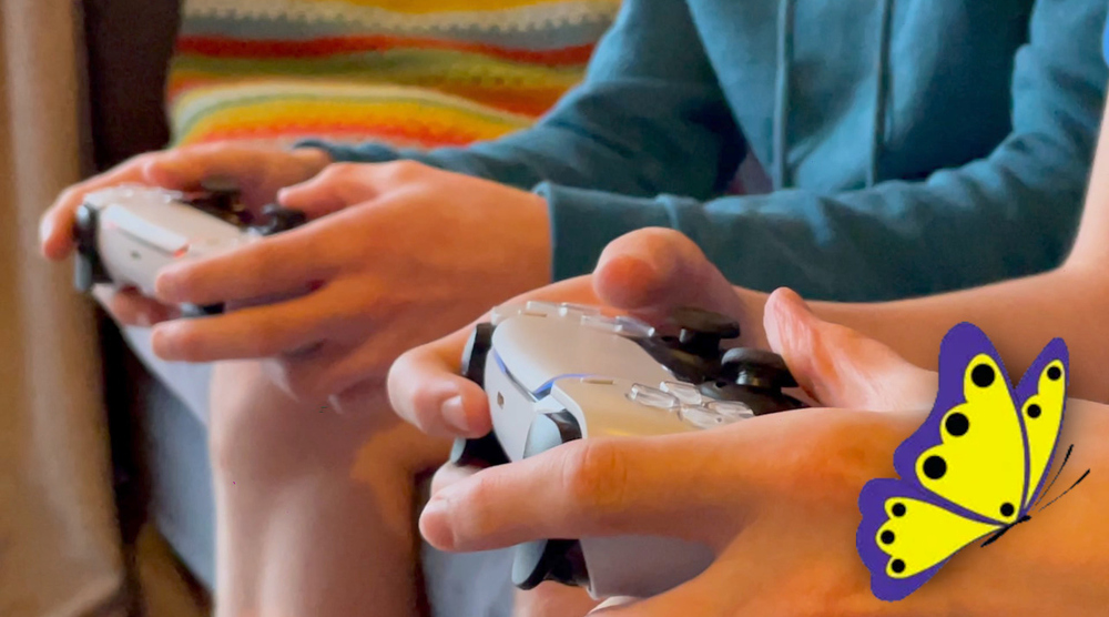 Taming Gaming Article with games controller in somones hands